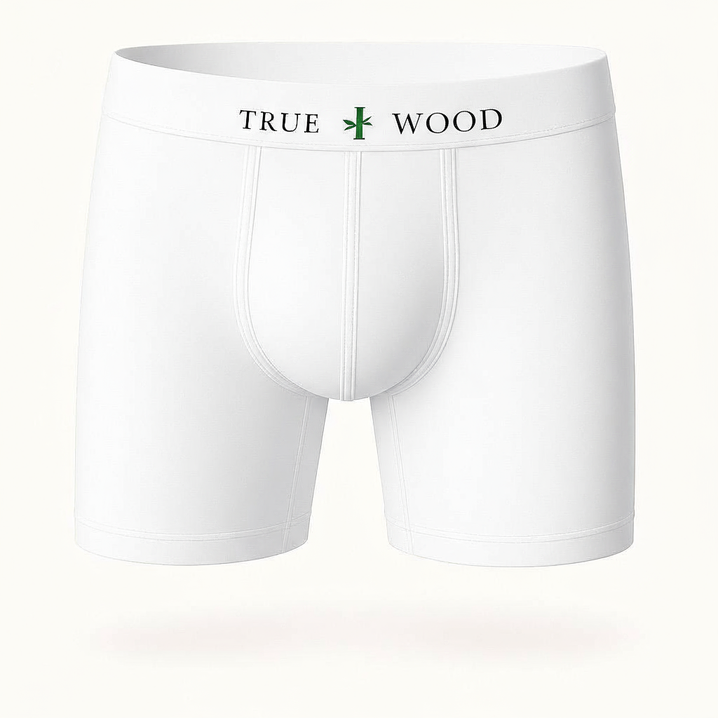 White men's boxer briefs with the words 'TRUE WOOD' in black and a green leaf icon on the waistband, styled in a clean serif font, displayed against a light background.