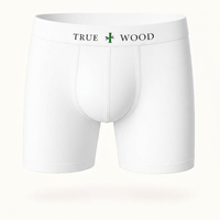 White men's boxer briefs with the words 'TRUE WOOD' in black and a green leaf icon on the waistband, styled in a clean serif font, displayed against a light background.