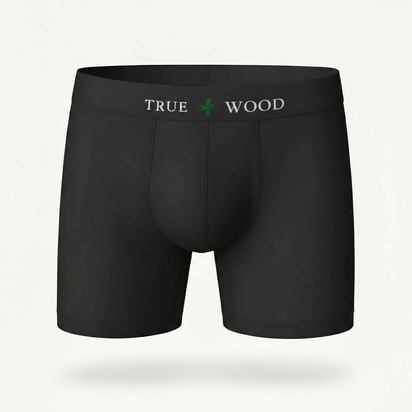 White men's boxer briefs with the words 'TRUE WOOD' in black and a green leaf icon on the waistband, styled in a clean serif font, displayed against a light background.